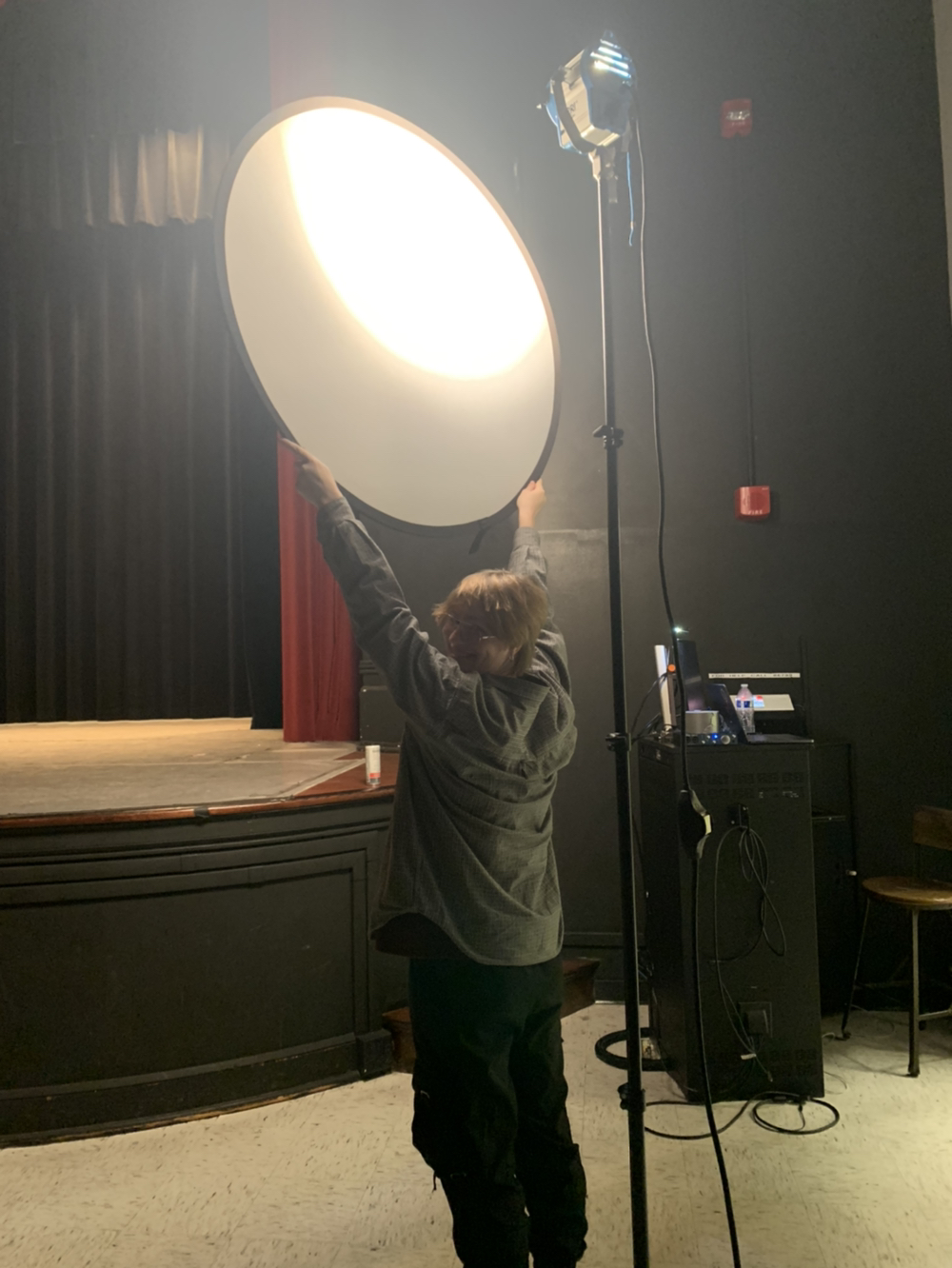 Holding a diffuser over a light during Curtain Call